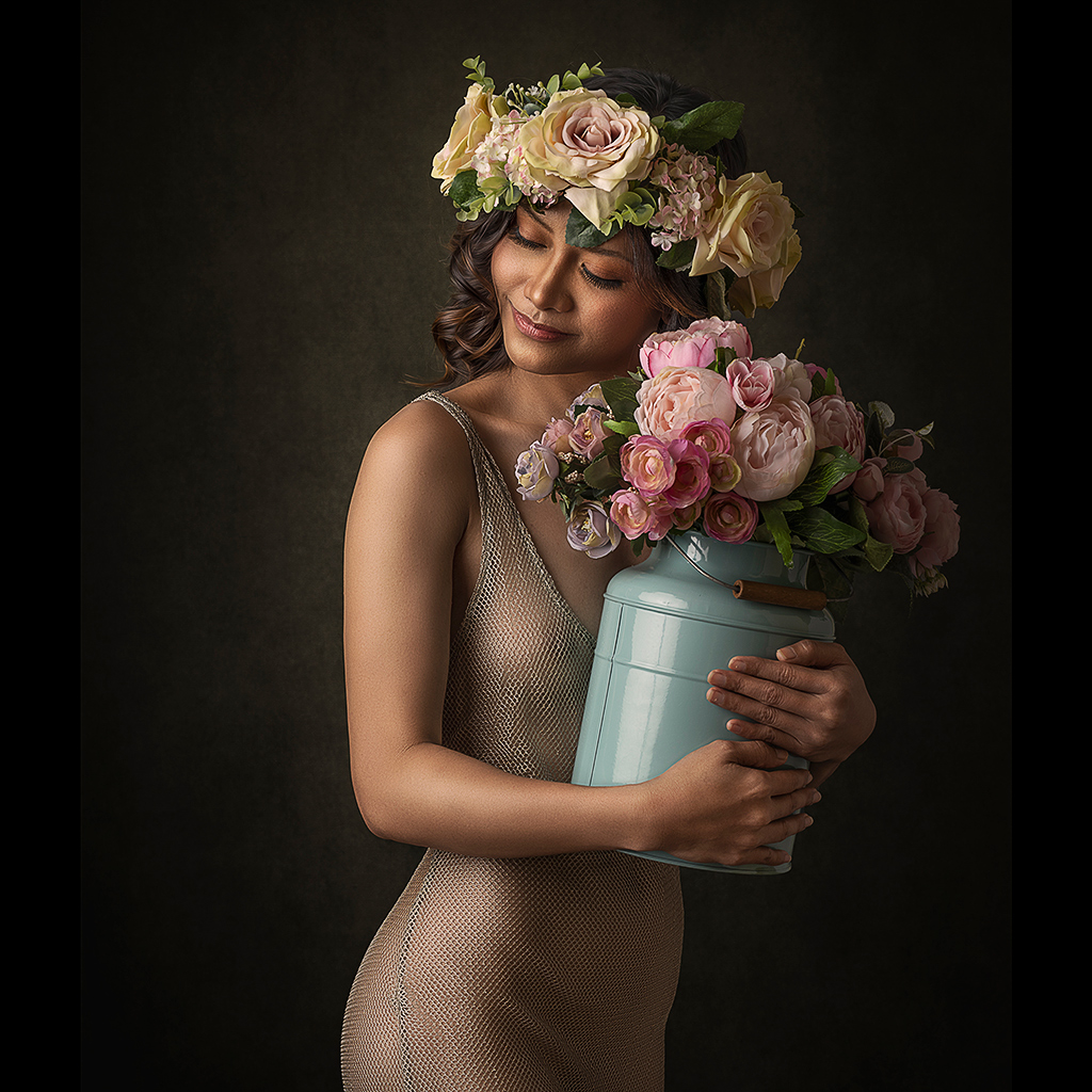 image of a young woman holding a vase of flowers